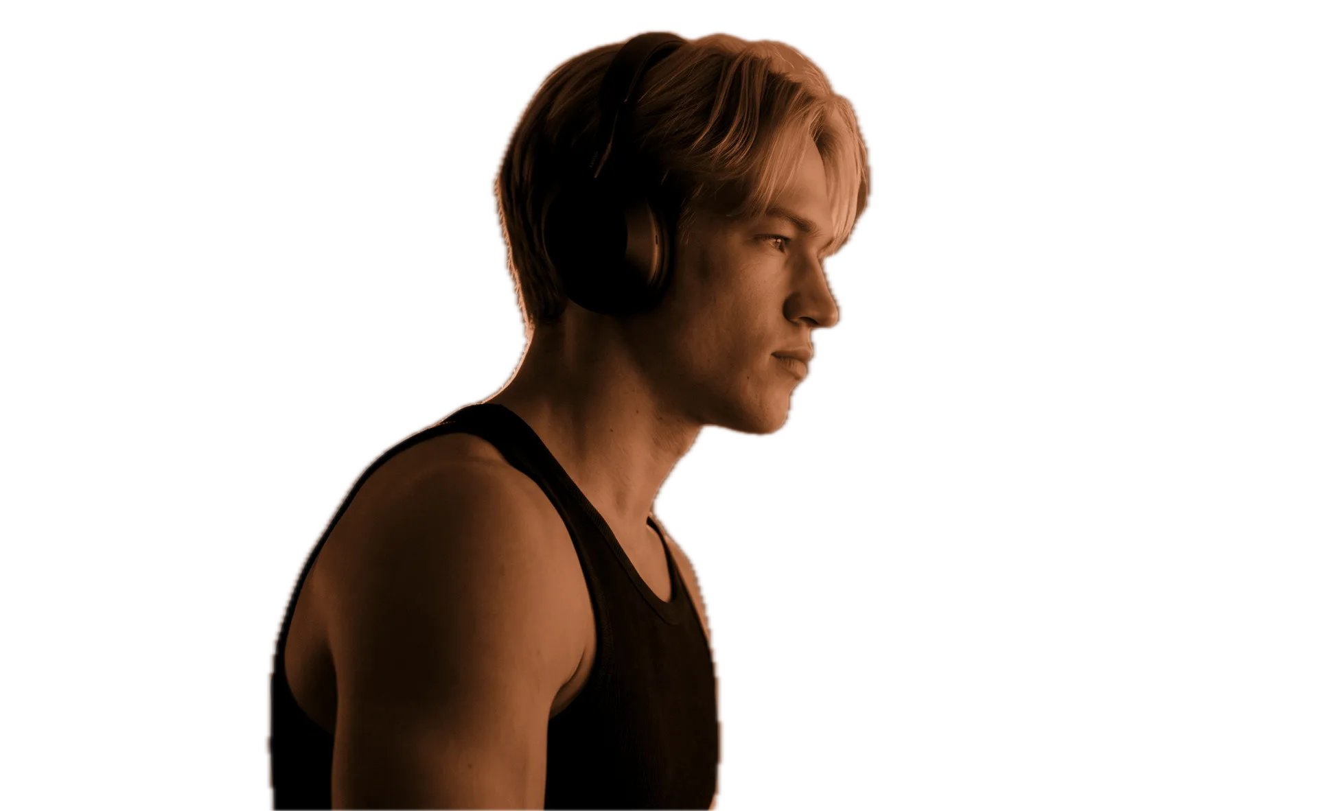 Arsenii Demydov in profile, headphones on, deep in the work